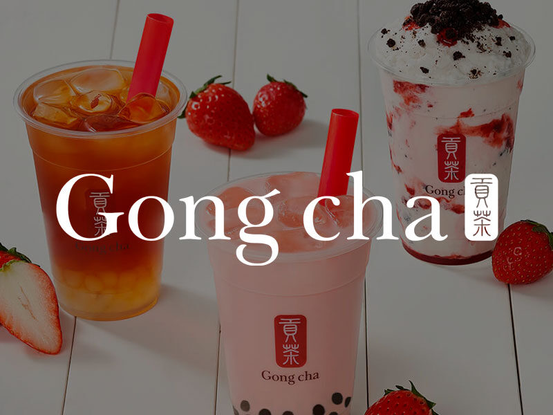 Gong cha logo over and image of three flavored teas and fresh strawberries.