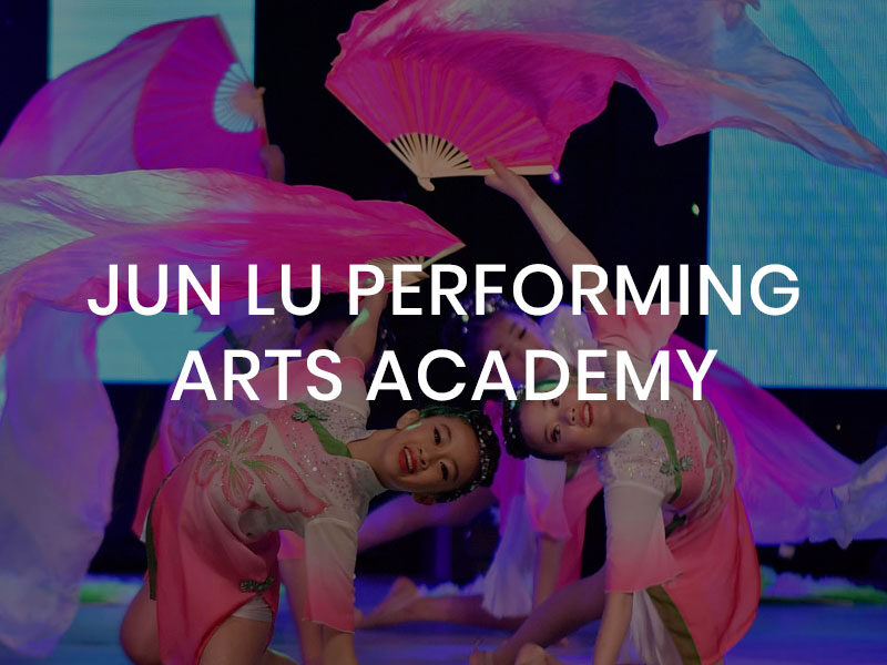 Jun Lu Performing Arts Academy logo over an image of young Chinese girls doing a performance dance.